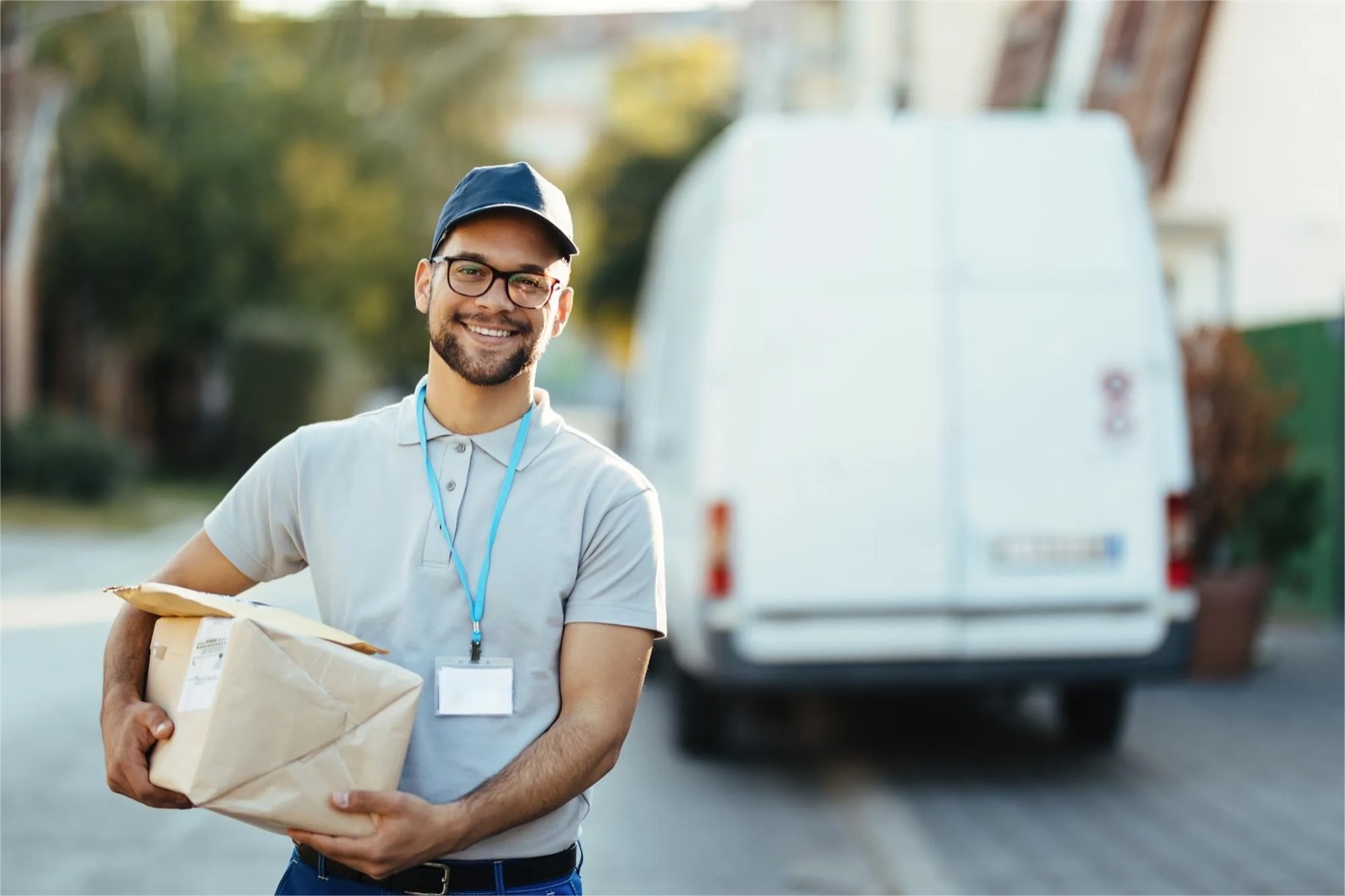 A delivery employee holding a box